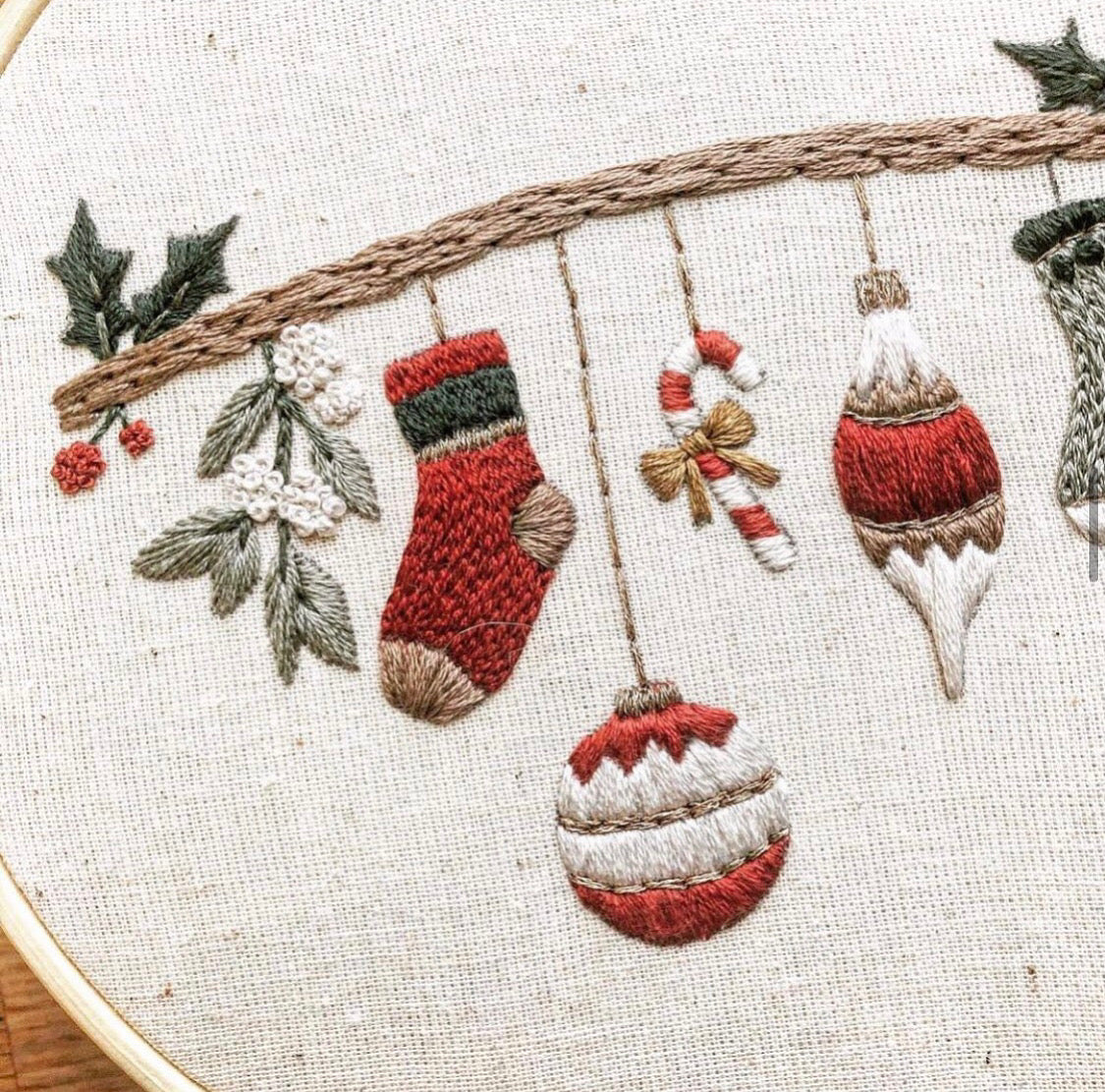 A closeup of the Deck The Halls Christmas Embroidery Pattern