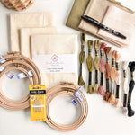 Beginner Embroidery Kit with fabric, hoops, threads, and needles for learning embroidery.