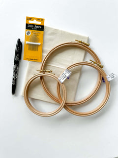 A flatlay of high quality embroidery supplies for beginners