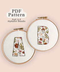 Floral-Filled Letters Embroidery Pattern Bundle showcasing floral letters A and B in embroidery hoops.