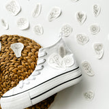 Floral embroidery designs with an example of how they can be embroidered onto white trainers