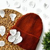  Floral embroidery designs with an example of how they can be embroidered onto a woolly hat