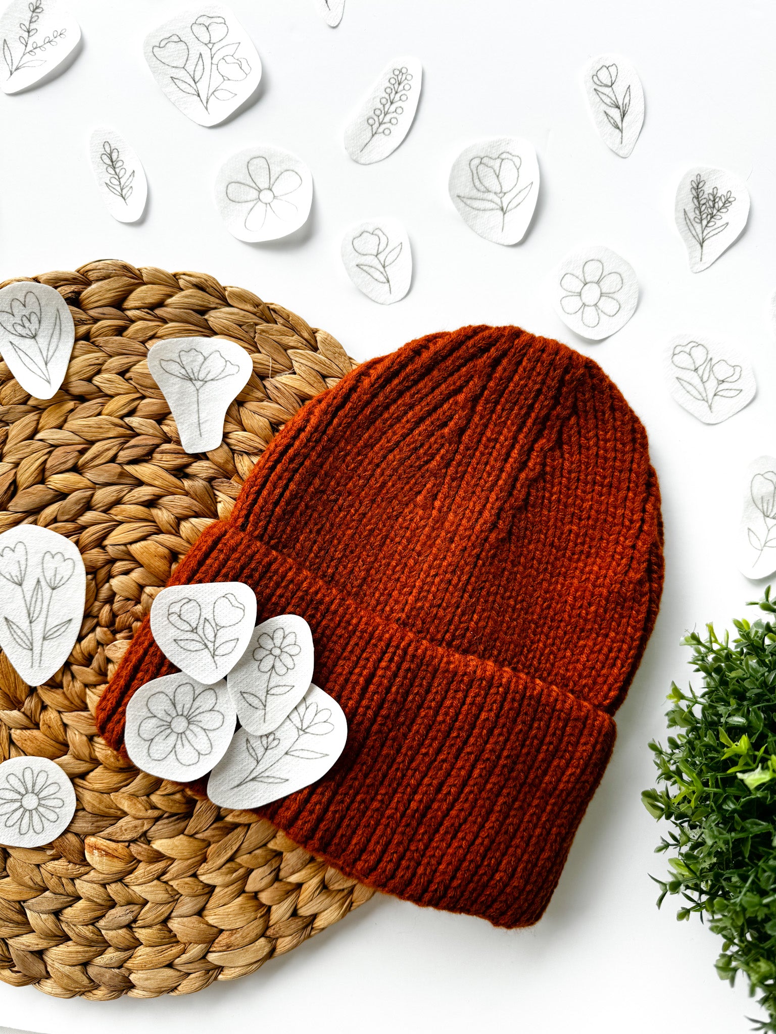  Floral embroidery designs with an example of how they can be embroidered onto a woolly hat