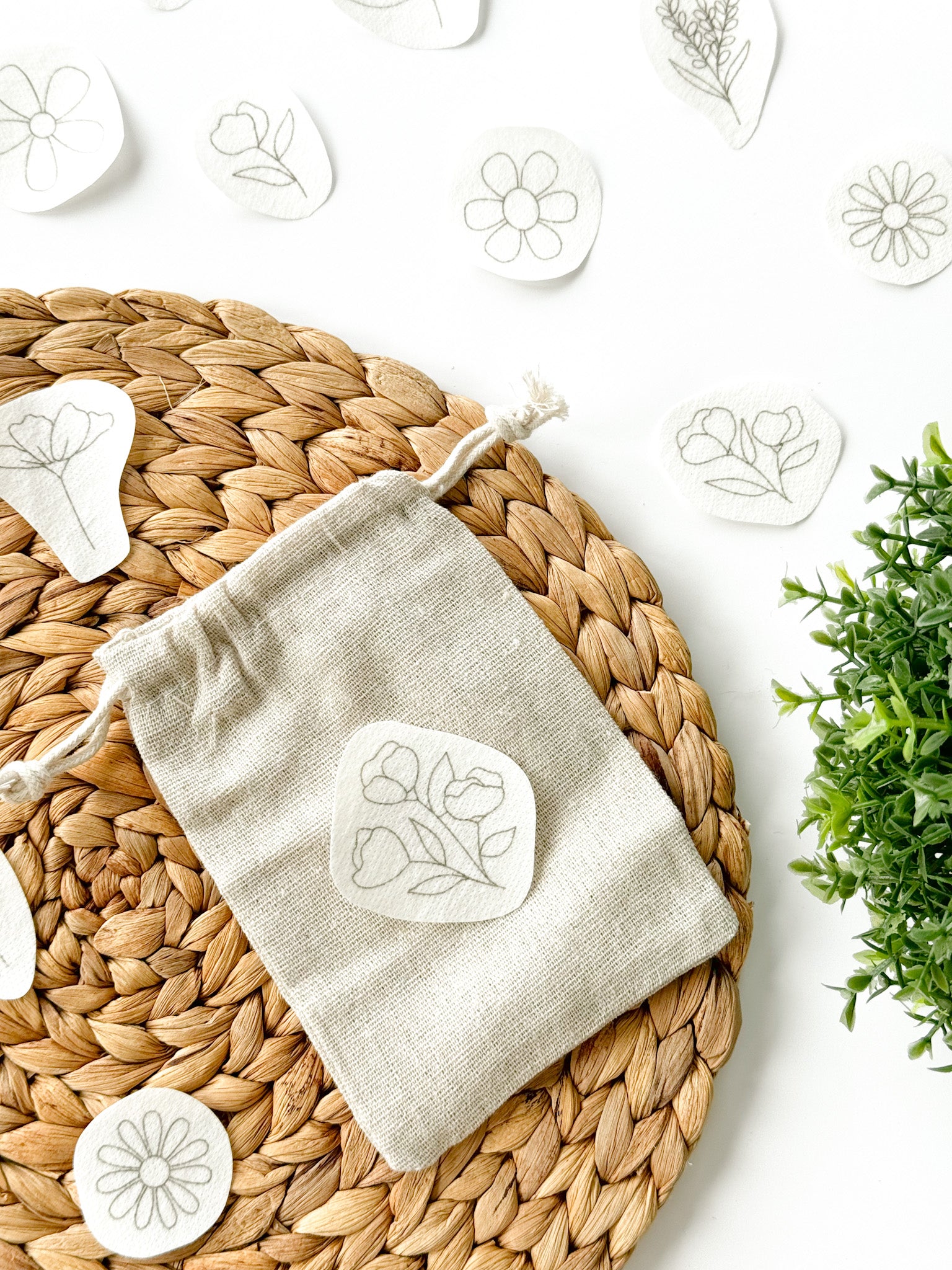 Floral embroidery pattern placed on a small jute bag