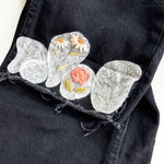 Examples of floral patterns that have been embroidered onto jeans