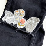 Examples of floral patterns that have been embroidered onto jeans