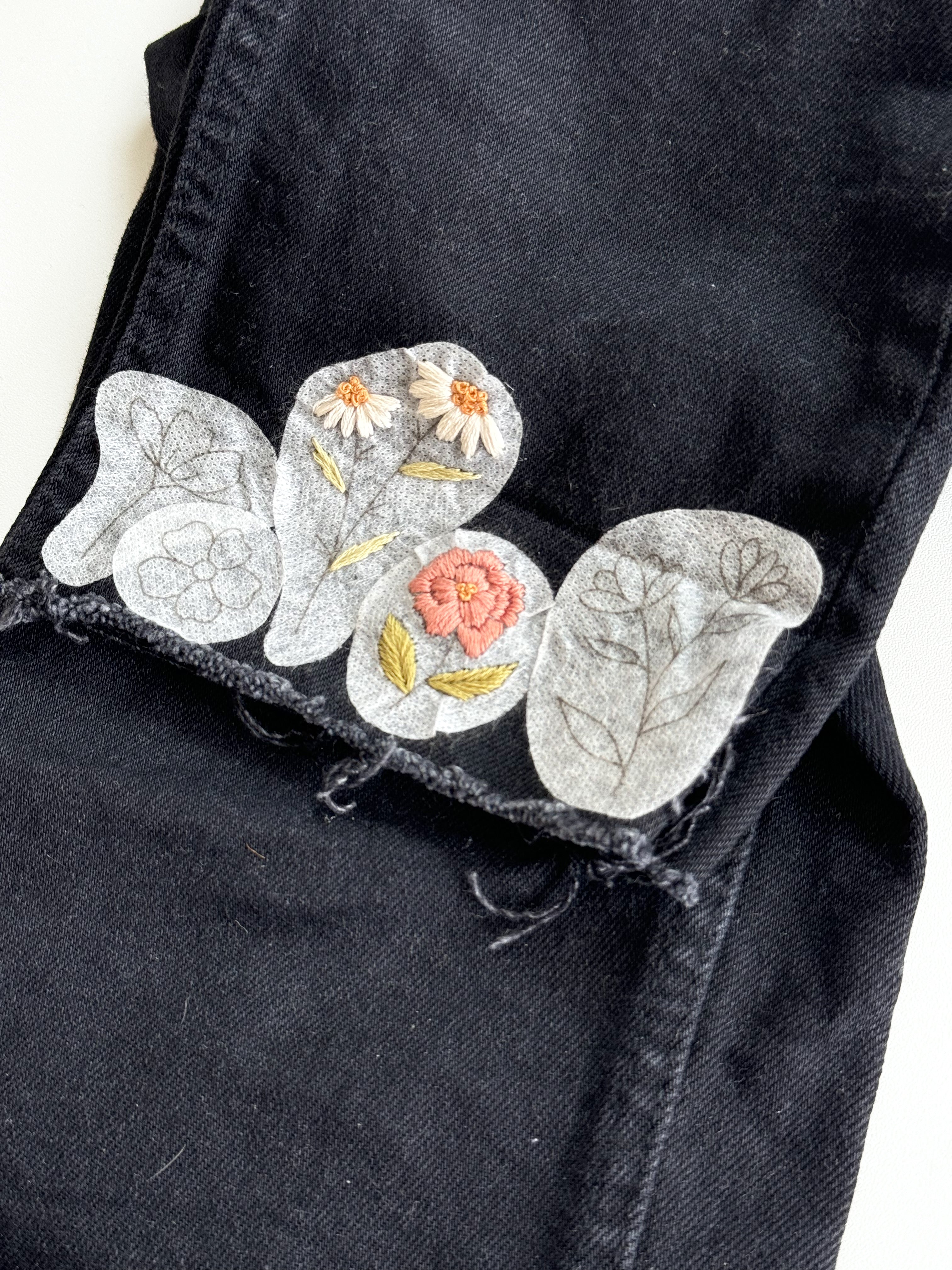 Examples of floral patterns that have been embroidered onto jeans