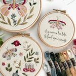 Wildflower Wings Butterfly Embroidery Pattern Bundle with colorful designs and embroidery threads displayed.