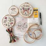 The butterfly embroidery kit featuring hoops, 3 patterns, thread, needles, fabirc and a Pilon FriXion Pen