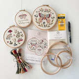 The butterfly embroidery kit featuring hoops, 3 patterns, thread, needles, fabirc and a Pilon FriXion Pen