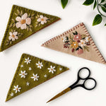 Felt Bookmark Embroidery Kit showcasing intricately designed bookmarks with floral embroidery and scissors.