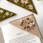 Beautiful handmade felt bookmarks from the bookmark embroidery kit featuring floral designs, perfect for book lovers.