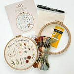 A beginner embroidery kit spread out on a flat surface