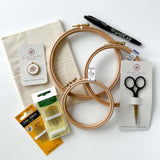A flatlay of embroidery supplies. A bundle of the perfect embroidery supplies