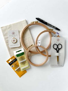 A flatlay of embroidery supplies. A bundle of the perfect embroidery supplies