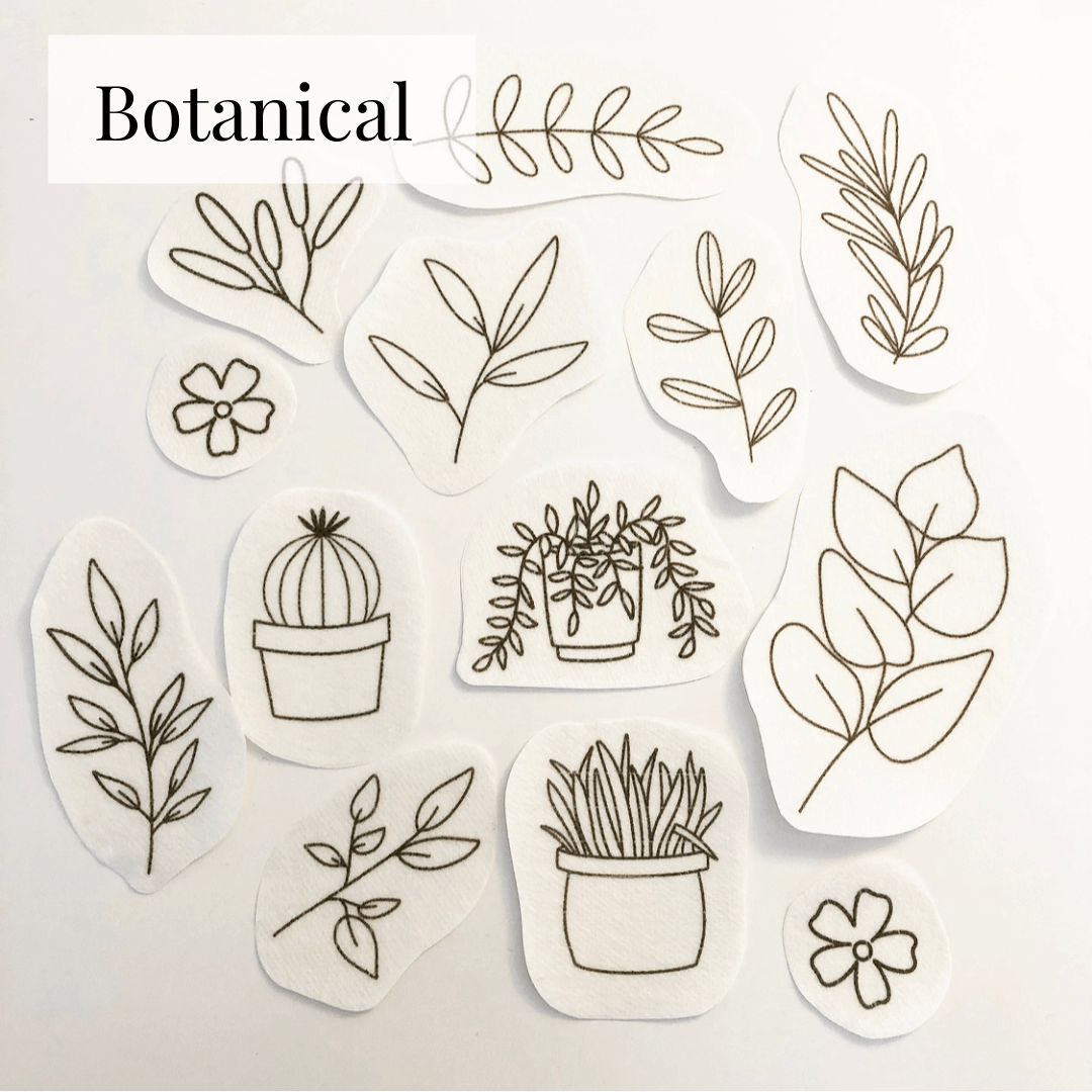 The botanical Stick and Stitch embroidery patterns laid out on a flat surface