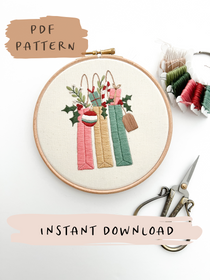 A Christmas embroidery pattern featuring 3 colorful gift bags available as an instant download