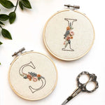 The floral initial embroidery patterns featuring the letters 'I' and 's'