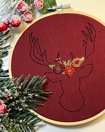 The stag embroidery pattern featuring a simple stag outline with a floral headdress 